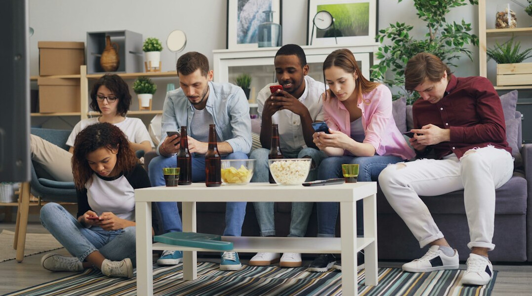 people using social media on phones
