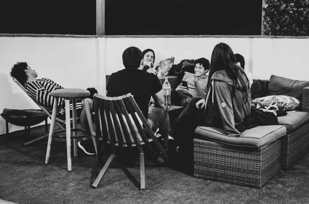 group of friends discussing on couch